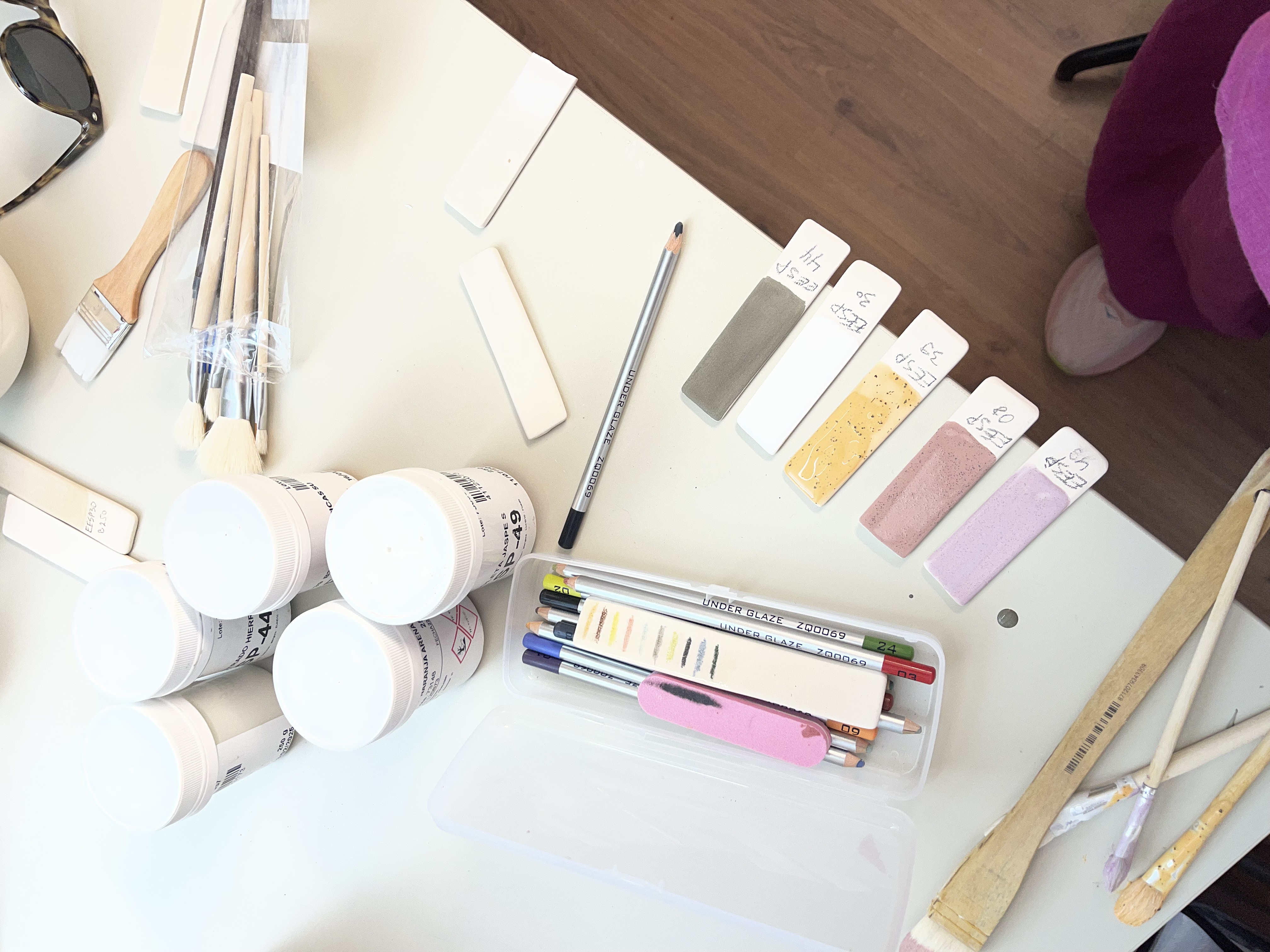 Glazing tools and colour swatches at the studio