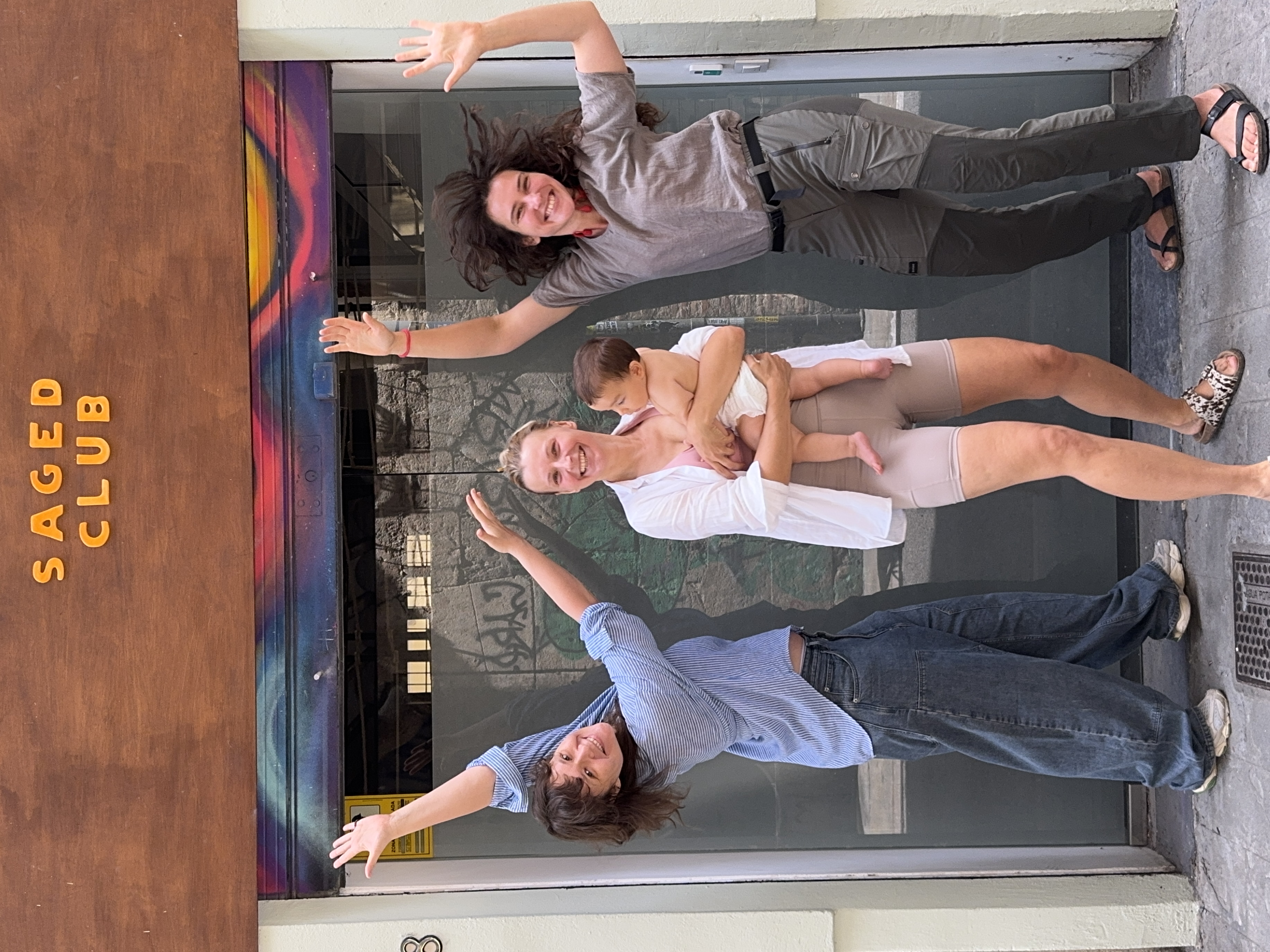 Friends at Saged.club studio entrance